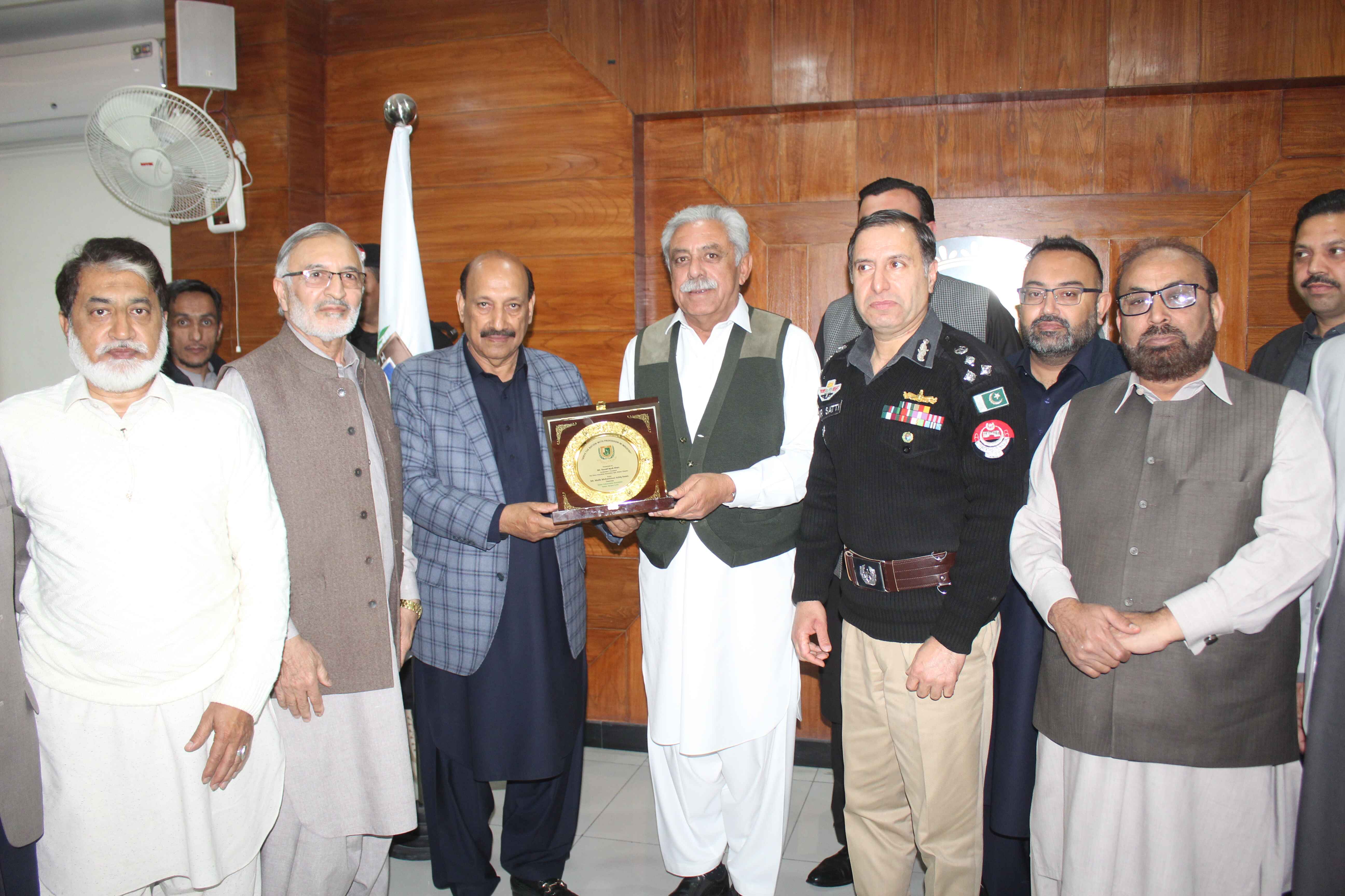Mr.Malik Ashiq Awan Chairman HIA gives shield to Mr. Yousaf Ayub Khan Ex minister